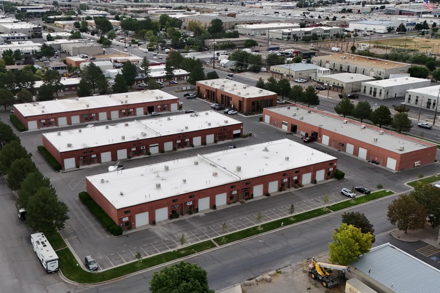 Aerial view of a multi-tenant industrial park along the I-15 corridor in Sandy, Utah