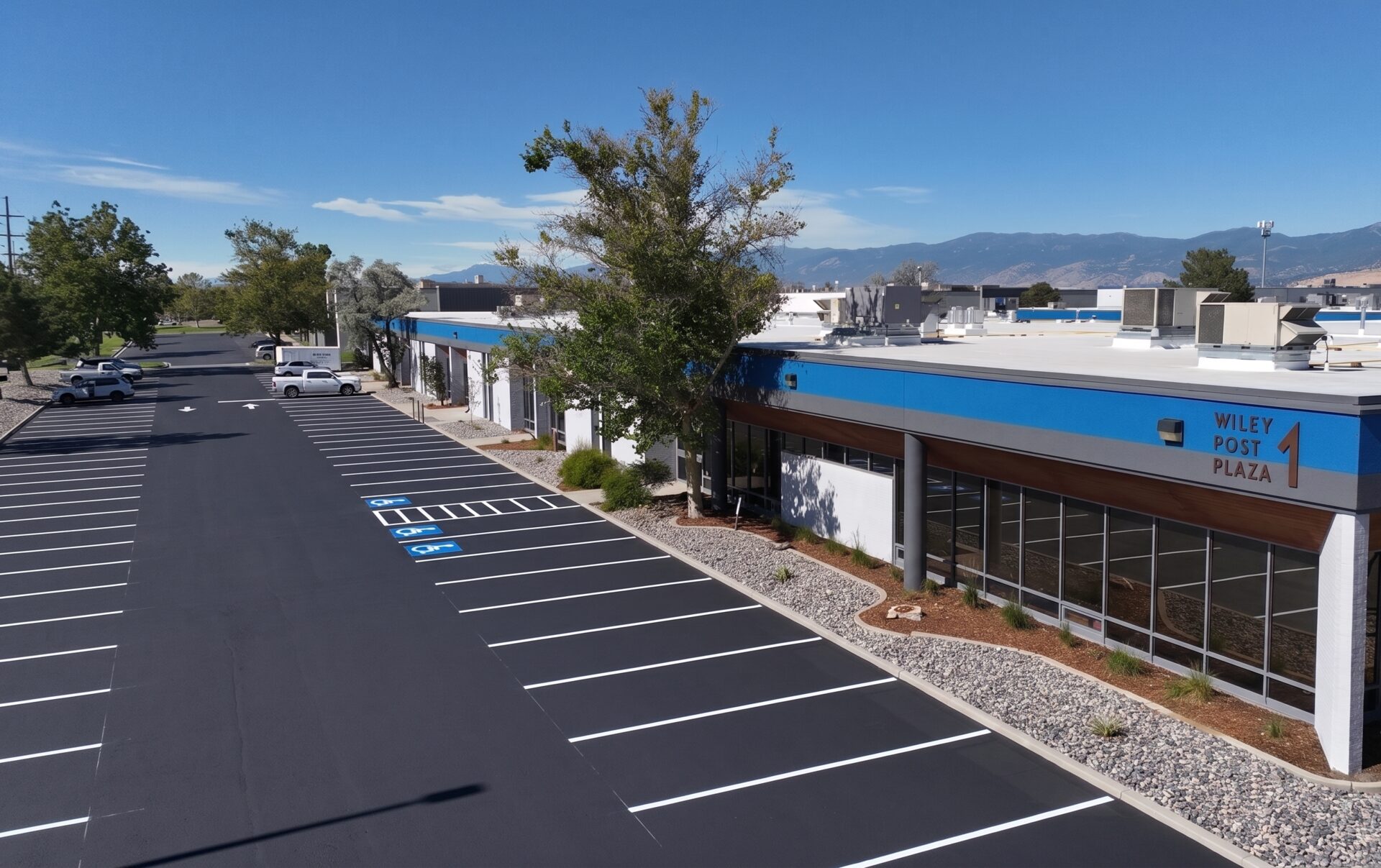 Repainted exterior of Airport Business Center at Wiley Post Plaza